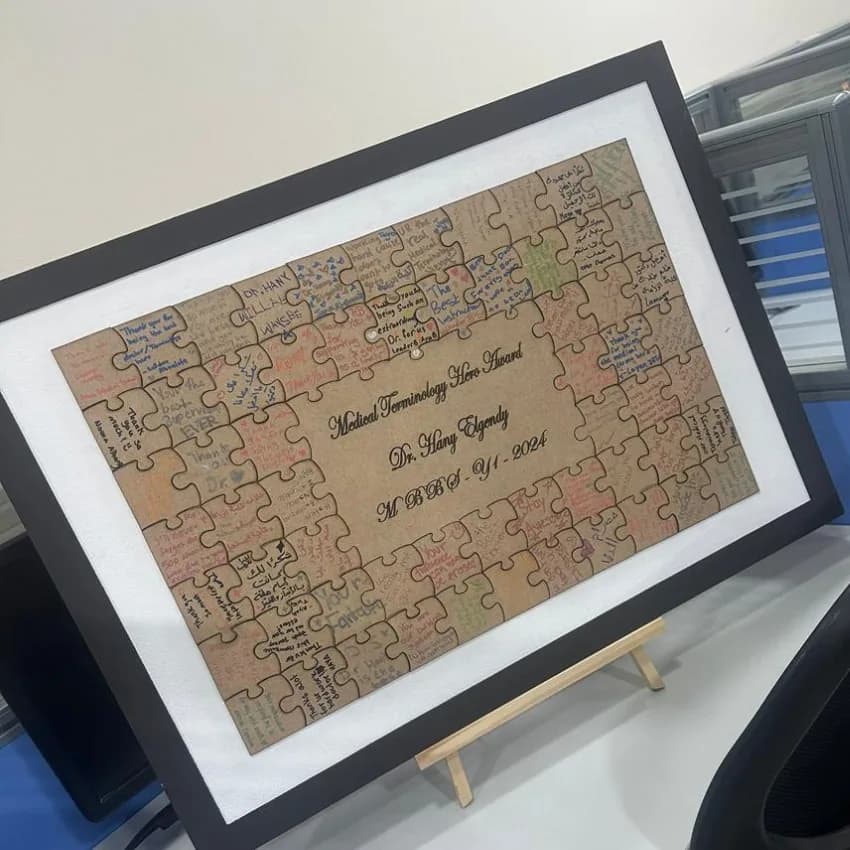 A commemorative frame signed by Dr. Hani Elgindi’s medical terminology students